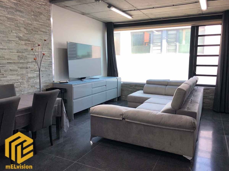 Sala de estar del loft en Alcobendas: Un espacio elegante y acogedor para relajarte.